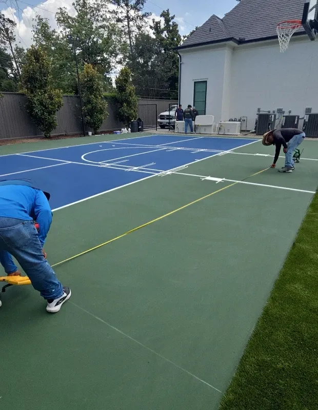 Crew applying acrylic surface coating